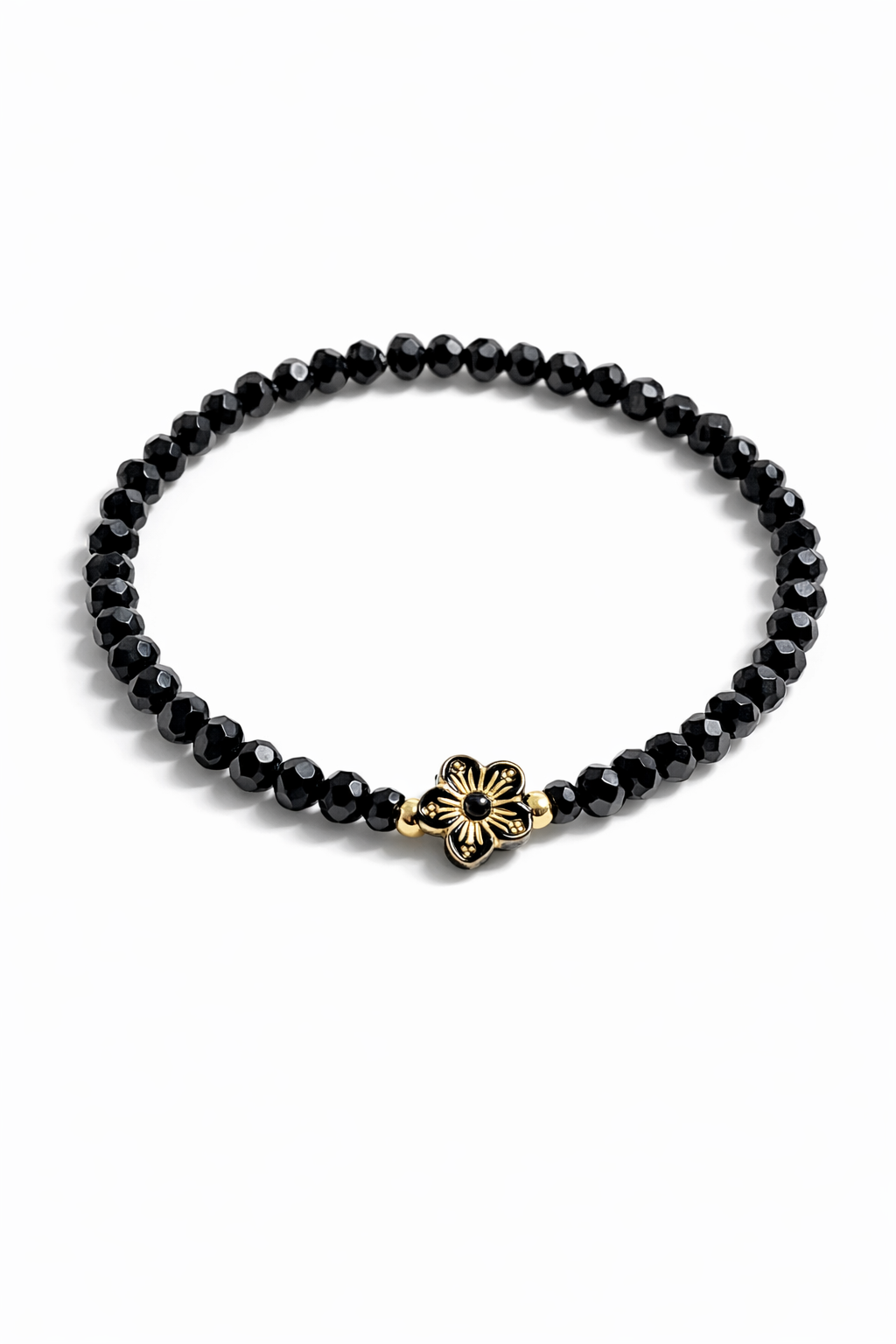 Armband schwarz mit Blümchen und goldenen Details