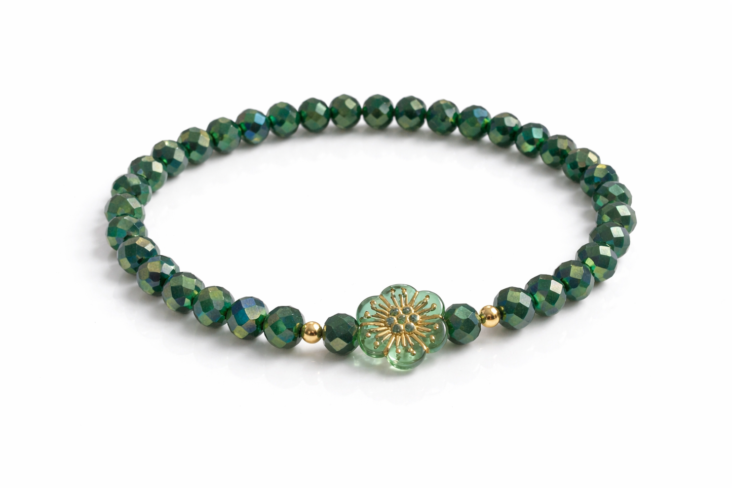 Armband grün mit Blume und goldenen Details