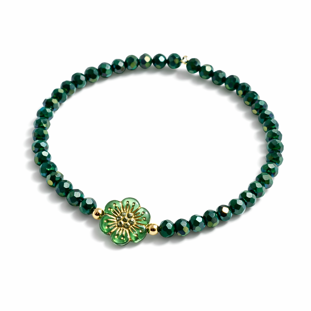 Armband grün mit Blume und goldenen Details