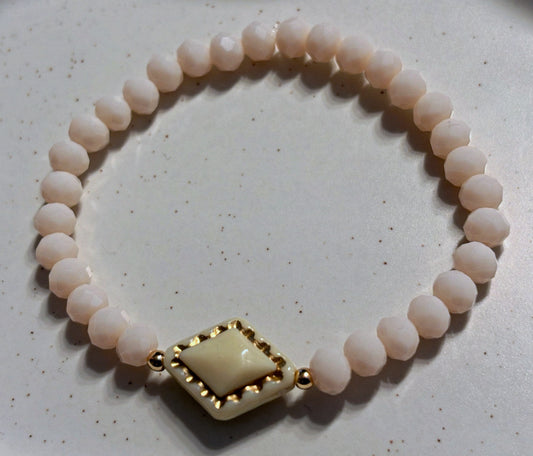 Bracelet cream tone with gold details
