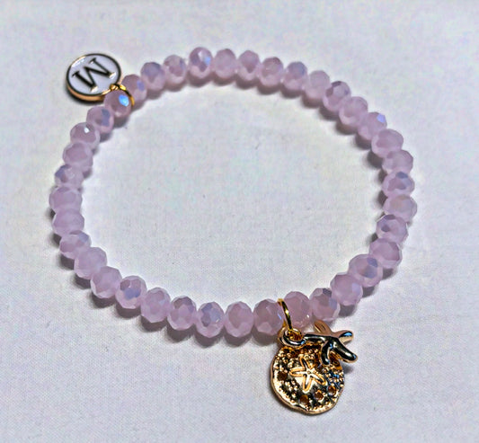 Armband rosa mit Seestern und goldenen Details