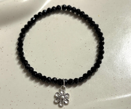 Armband schwarz mit Blumenanhänger