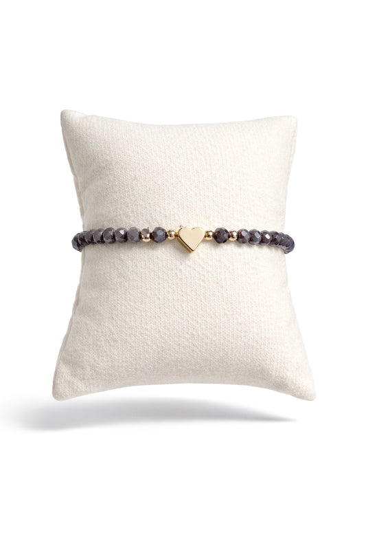 Dark purple bracelet with heart and gold details