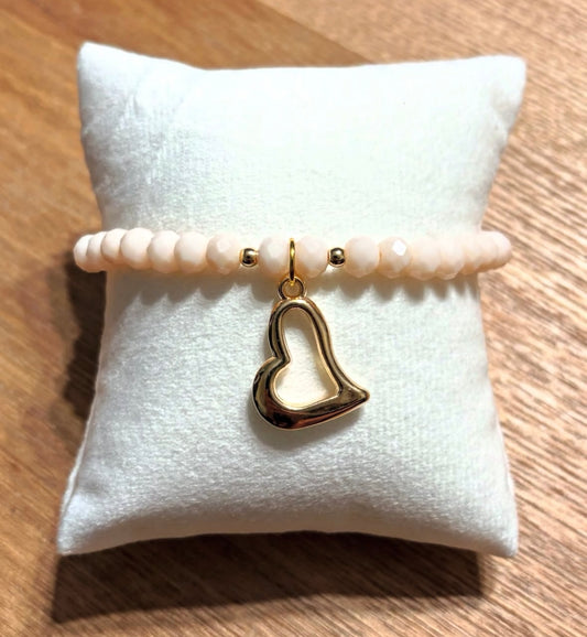 Bracelet with heart pendant and gold details