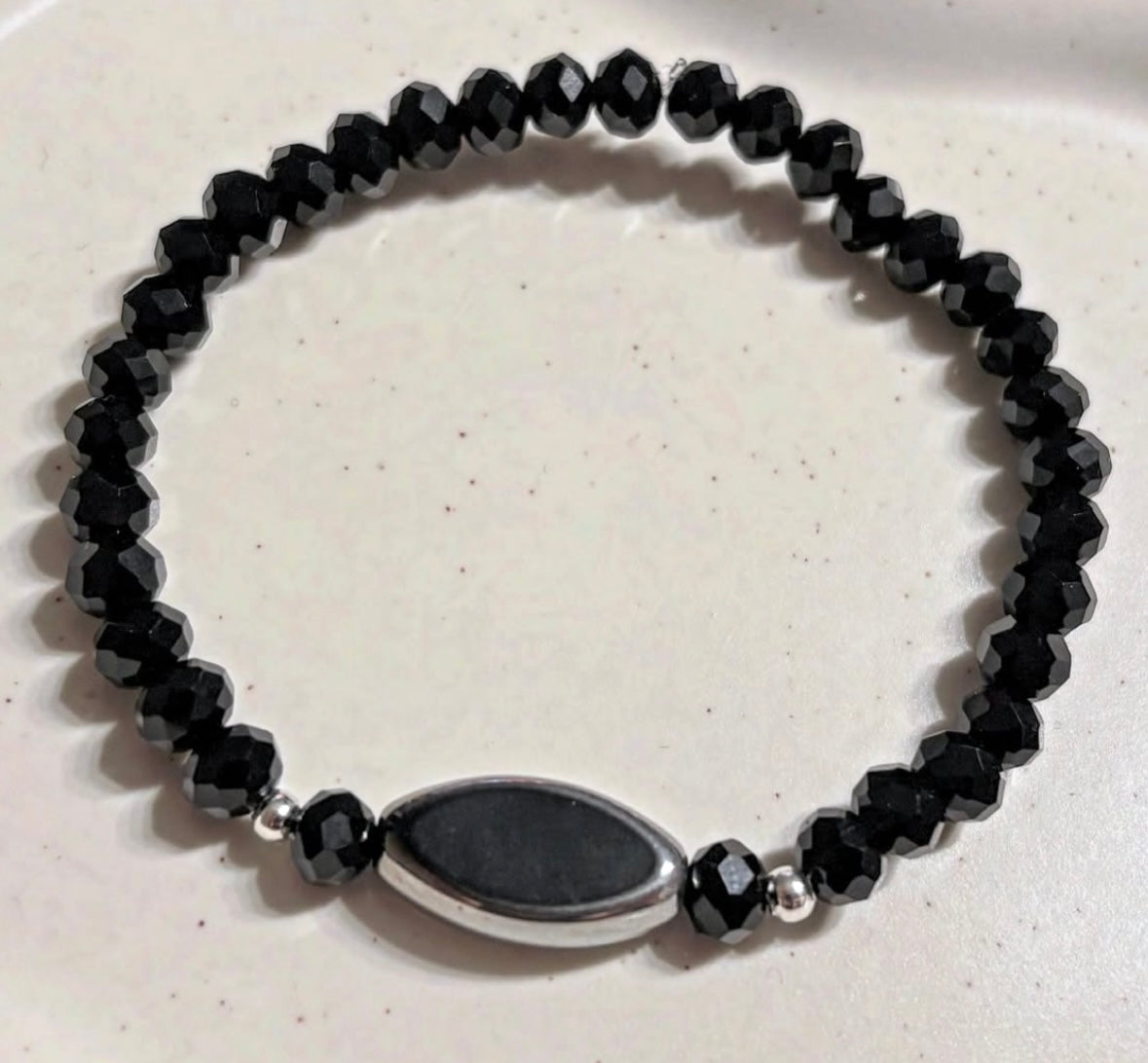 Elegant black bracelet with silver details