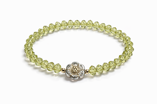 Light green bracelet with flower and gold details