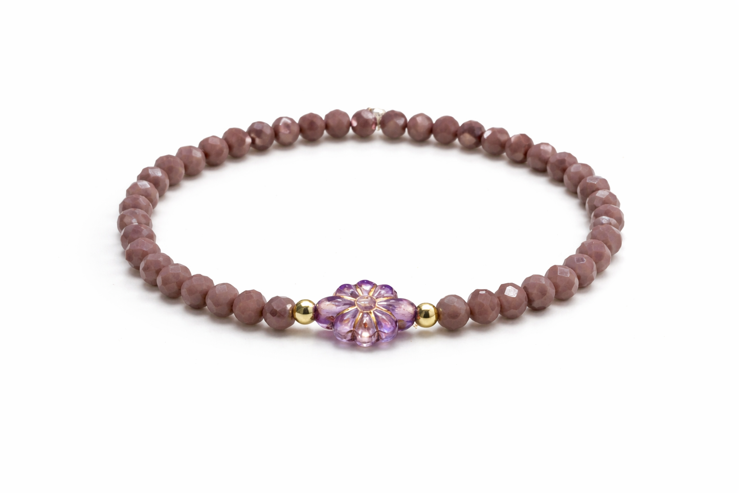 Bracelet in purple colors with gold details