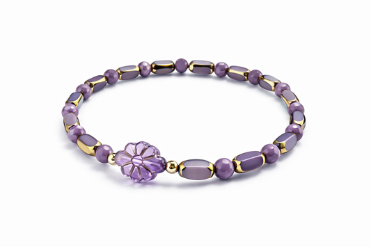 Armband violett mit Blume und goldenen Details