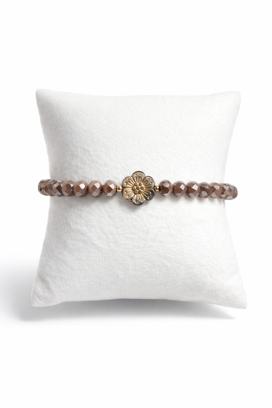 Brown bracelet with flower and gold details