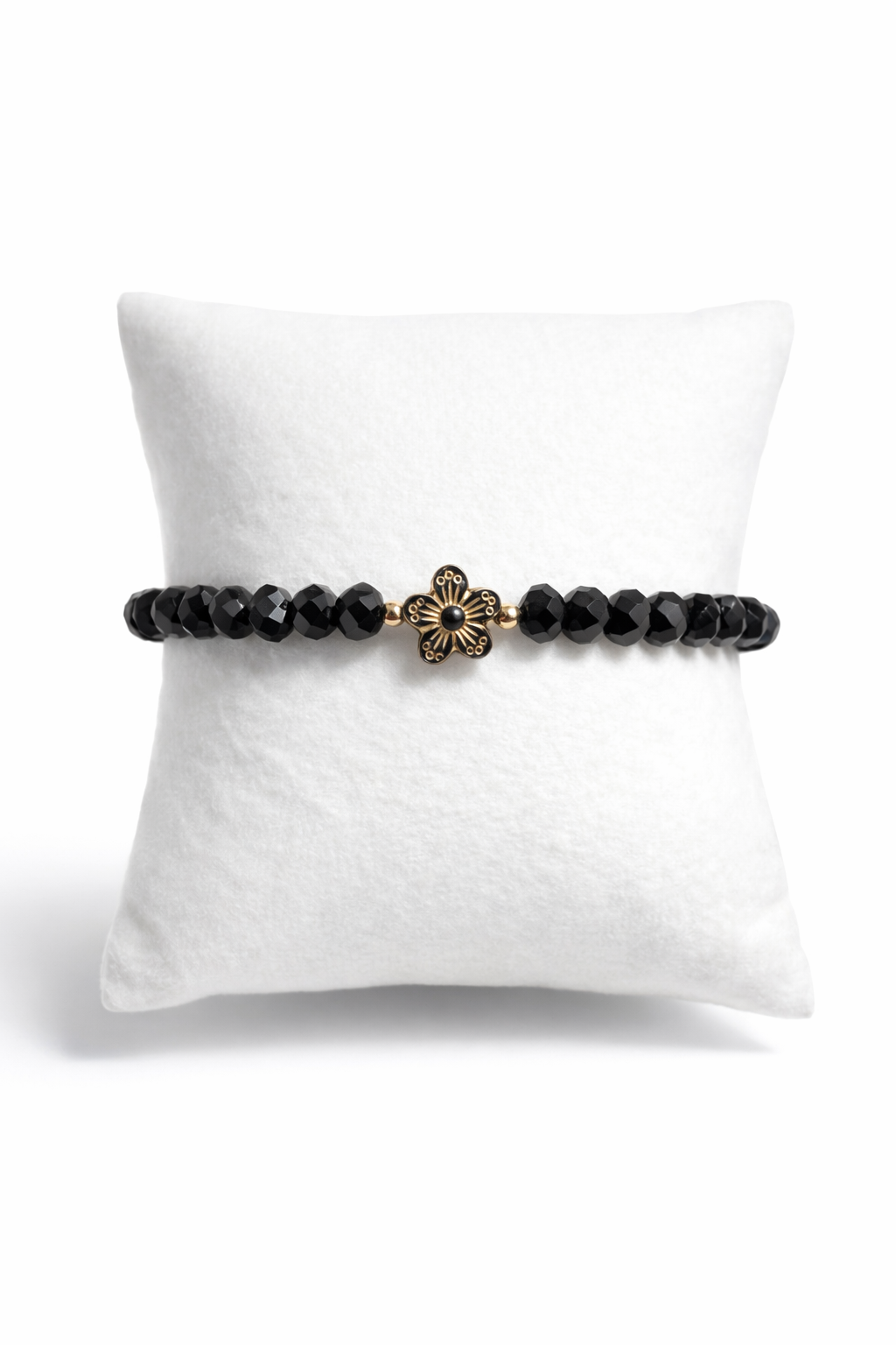 Armband schwarz mit Blume und goldene Details