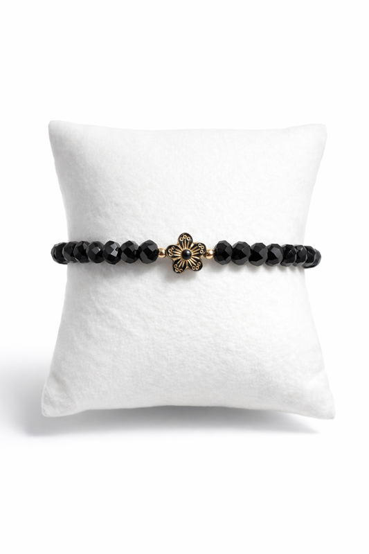 Armband schwarz mit Blume und goldene Details