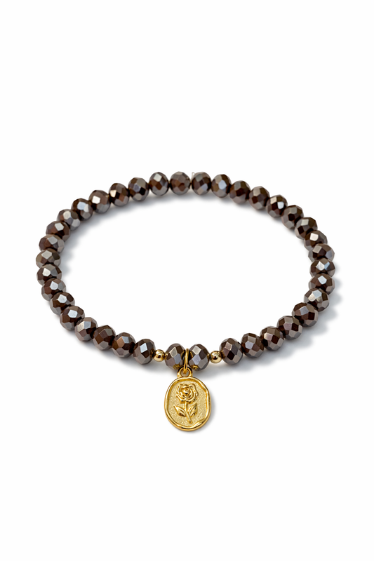 Brown bracelet with golden rose pendant