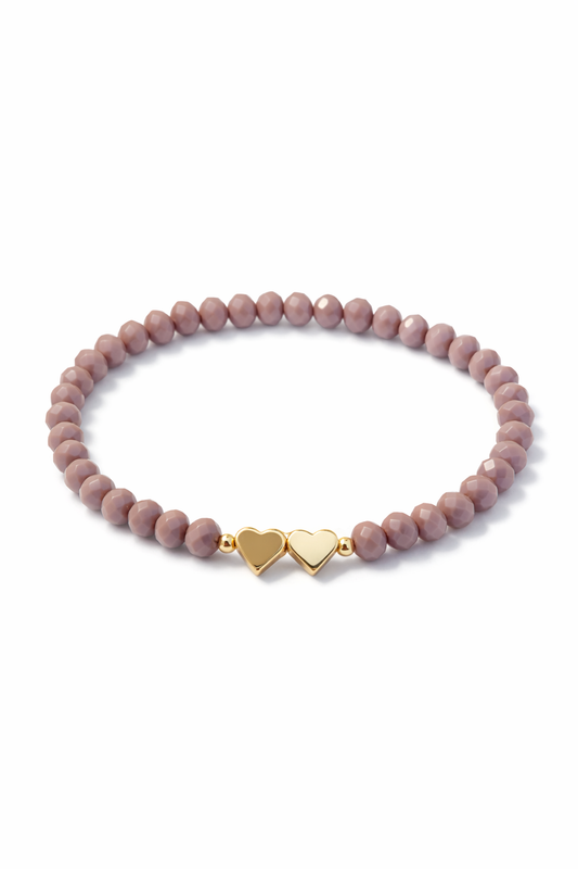 Bracelet in dusty rose with hearts and gold details
