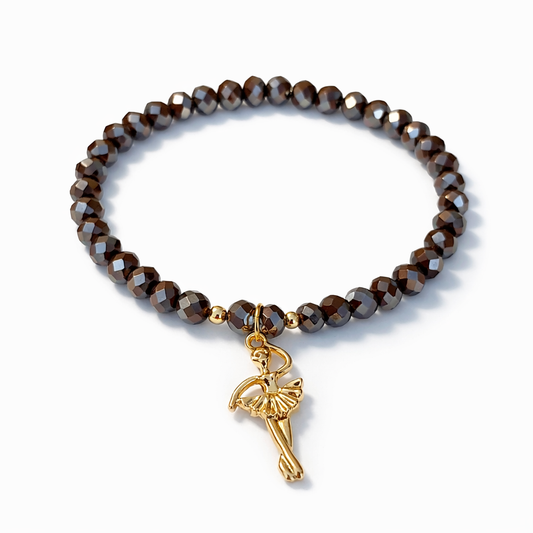Brown bracelet with ballerina charm and gold details