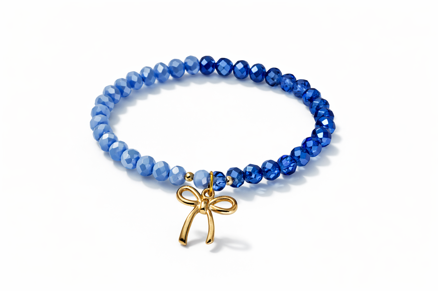 Blue bracelet with bow and gold details