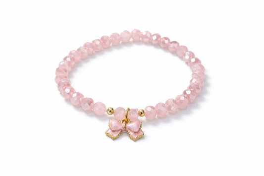 Pink bracelet with bow and gold details