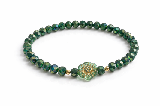 Green bracelet with flower and gold details