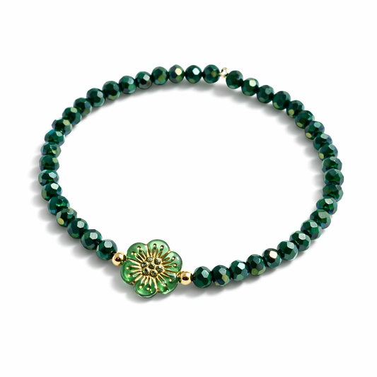 Green bracelet with flower and gold details