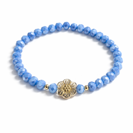 Blue bracelet with flower and gold details