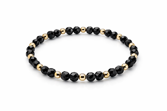 Armband schwarz mit goldenen Details