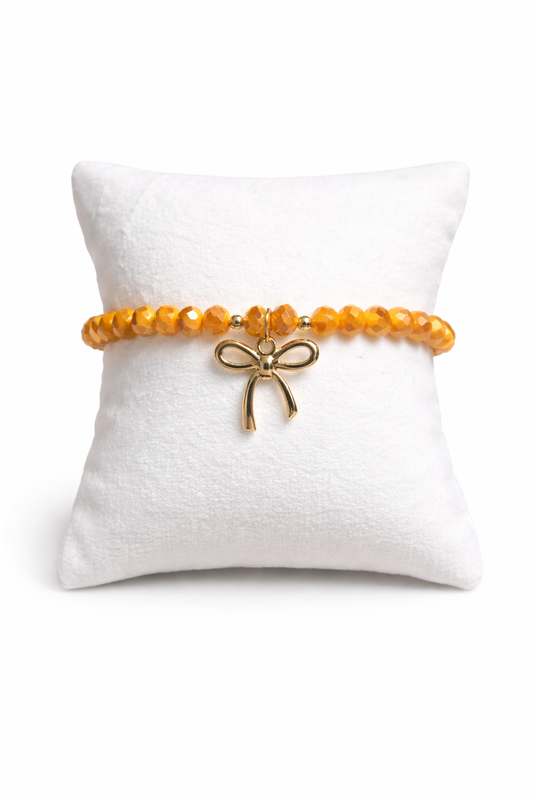 Orange bracelet with bow