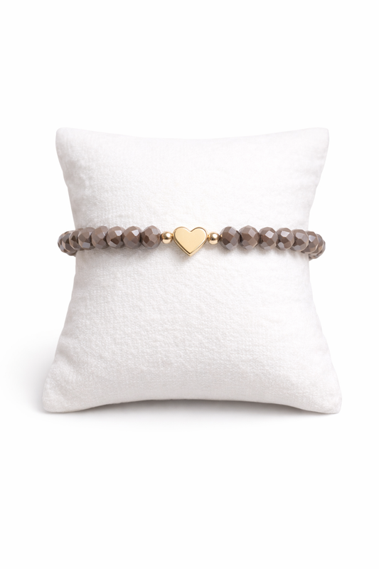Brown bracelet with heart and gold details