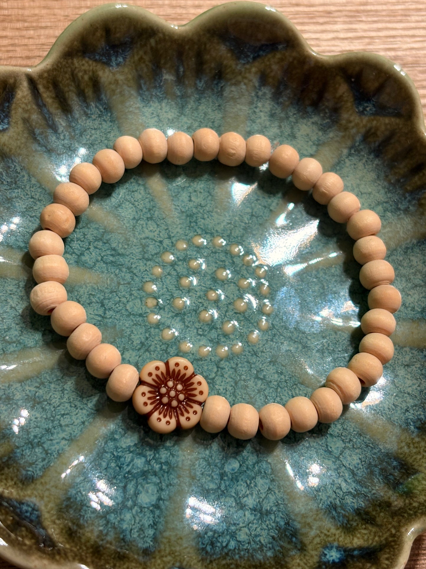 Bracelet made of natural wooden beads and flower