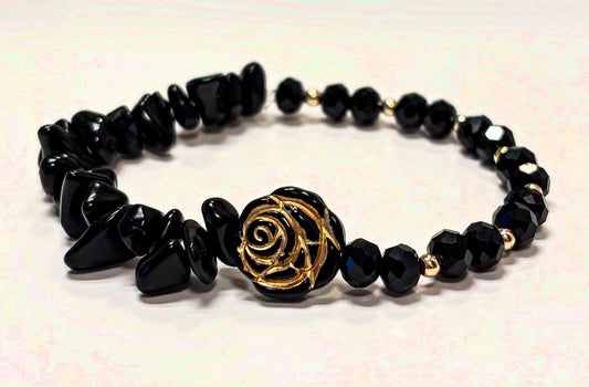 Armband Schwarz-Gold mit Rosenakzent