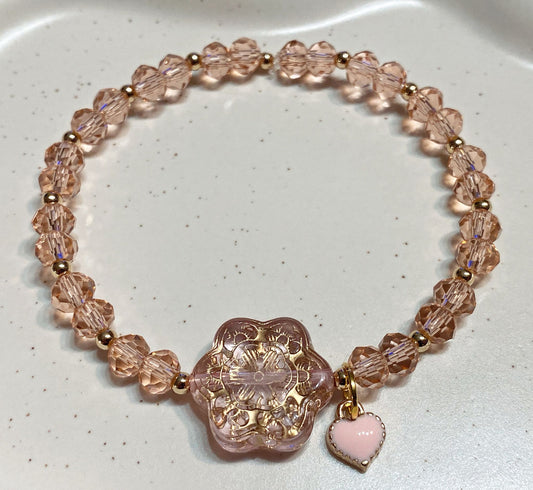 Armband rosa mit goldene Details und Herz