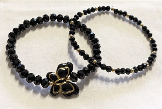 Armband Set schwarz mit goldene Details und Schmetterling